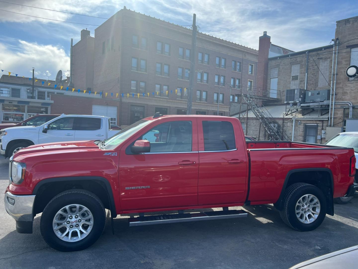 2019 Red /Charcoal GMC Sierra 1500 SLE (2GTV2MEC9K1) with an 5.3L V8 engine, Automatic transmission, located at 116 5th Avenue South, Lewistown, MT, 59457, 47.063877, -109.427879 - Discover the rugged versatility of the 2019 GMC Sierra 1500 SLE Double Cab 4WD. This truck is built to handle tough tasks with ease, whether you're tackling a worksite or heading off-road for adventure. Equipped with a powerful 5.3L V8 engine and advanced 4WD system, the Sierra 1500 SLE delivers im - Photo#5